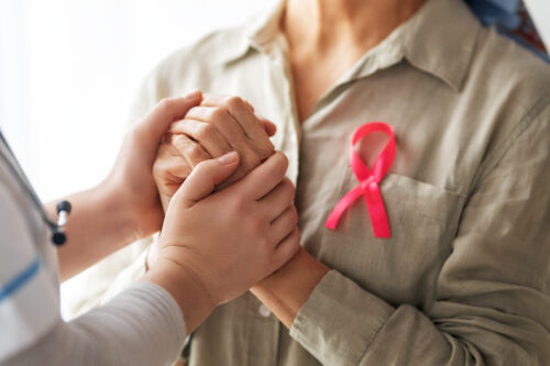 Female patient listening to doctor in medical office.