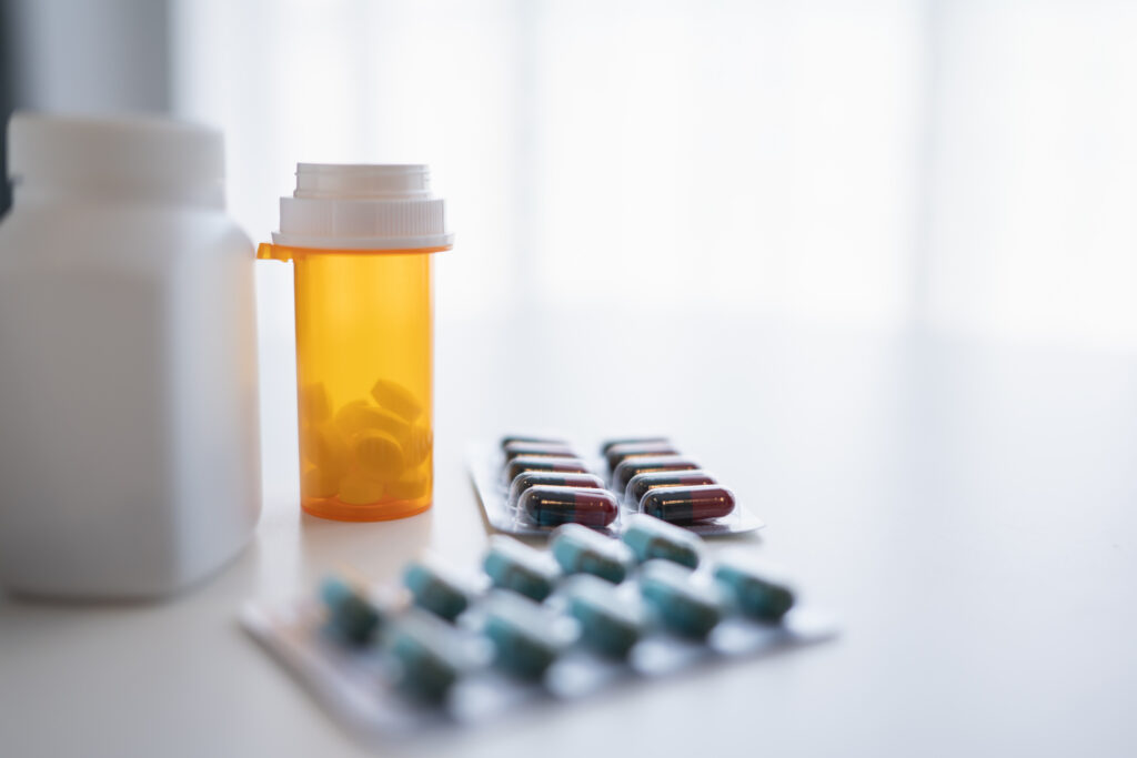 pills and capsules on white background